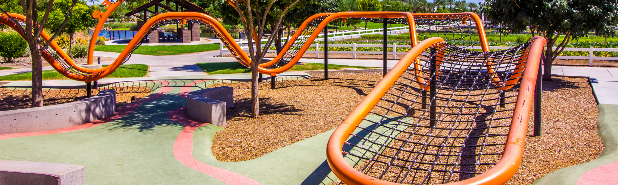 playground with light tan rubber mulch 